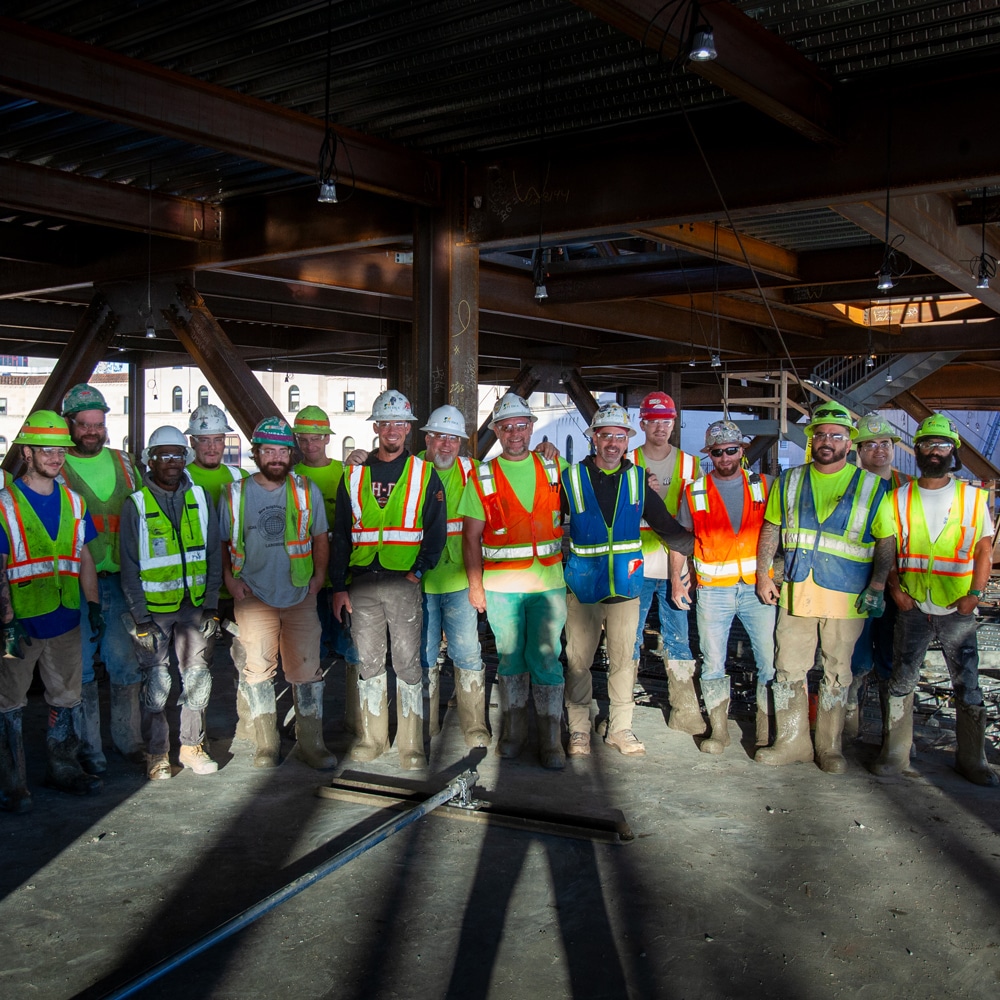 CBS workers standing together for a photo on a job site