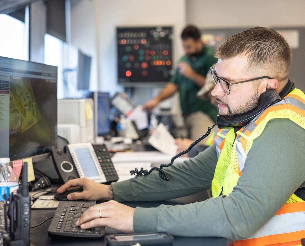 CBS employee using the computer while on the phone