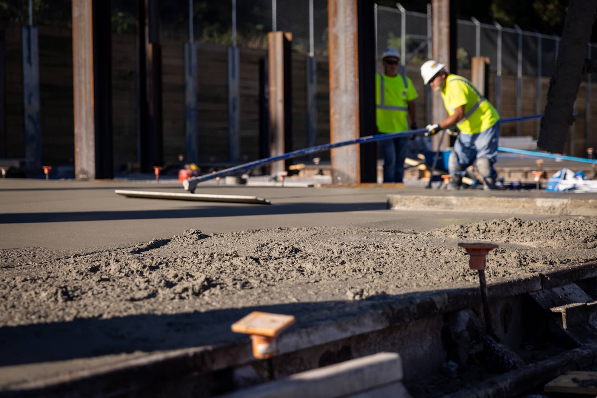lindy team road rolling and sealcoating during the night with spotlights