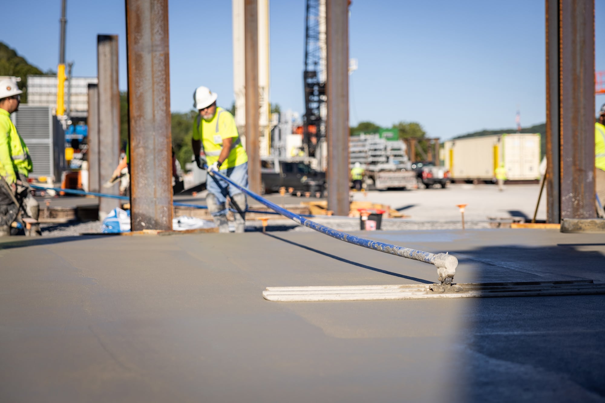 working smoothing concrete with tool